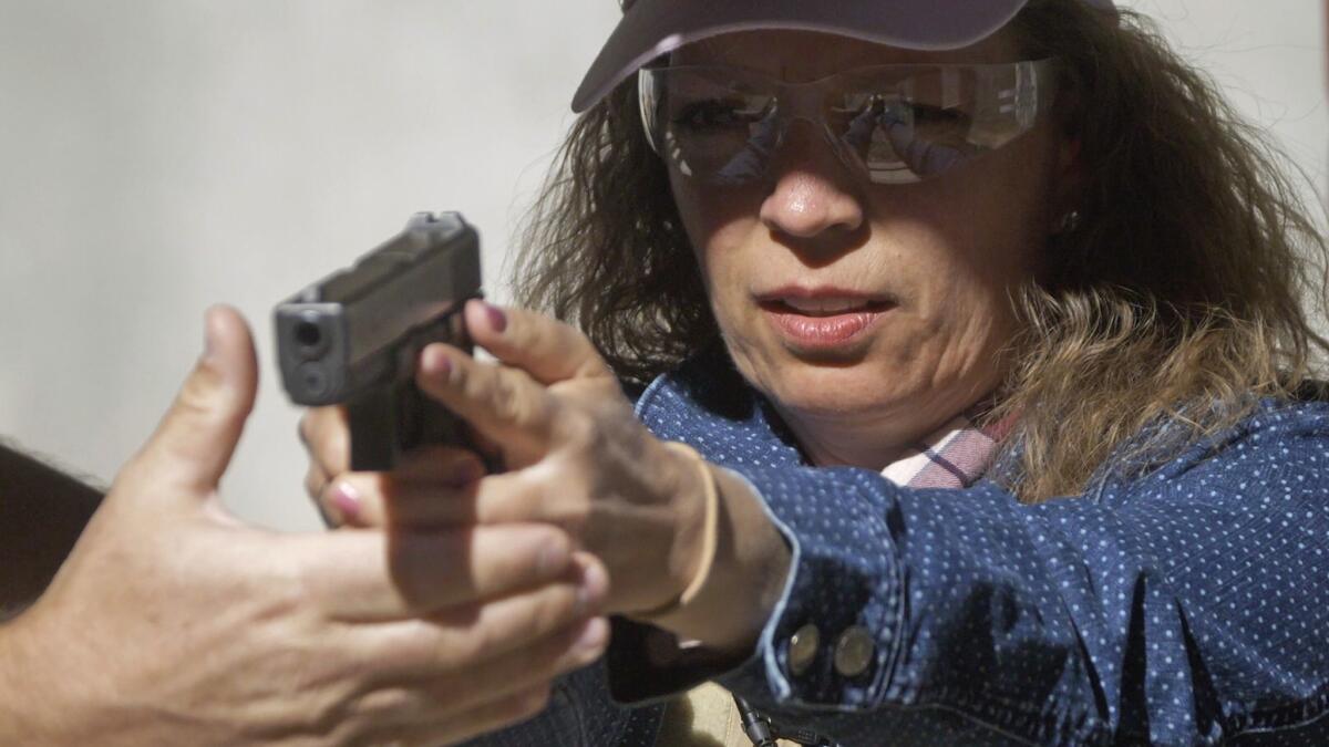 School secretary Cindy Bullock takes part in shooting drills in Utah.