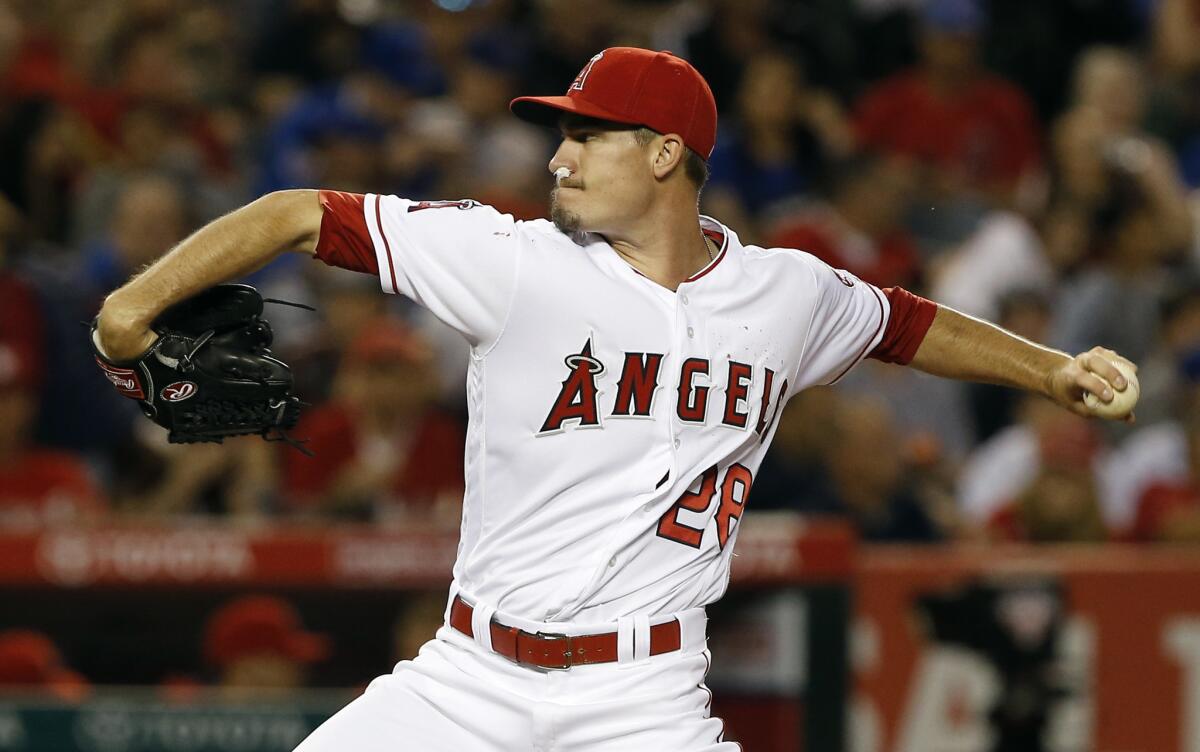 Angels starting pitcher Andrew Heaney returns to pitch with a nose plug, after a bloody nose caused a delay, during the second inning of his start on Apr. 5.