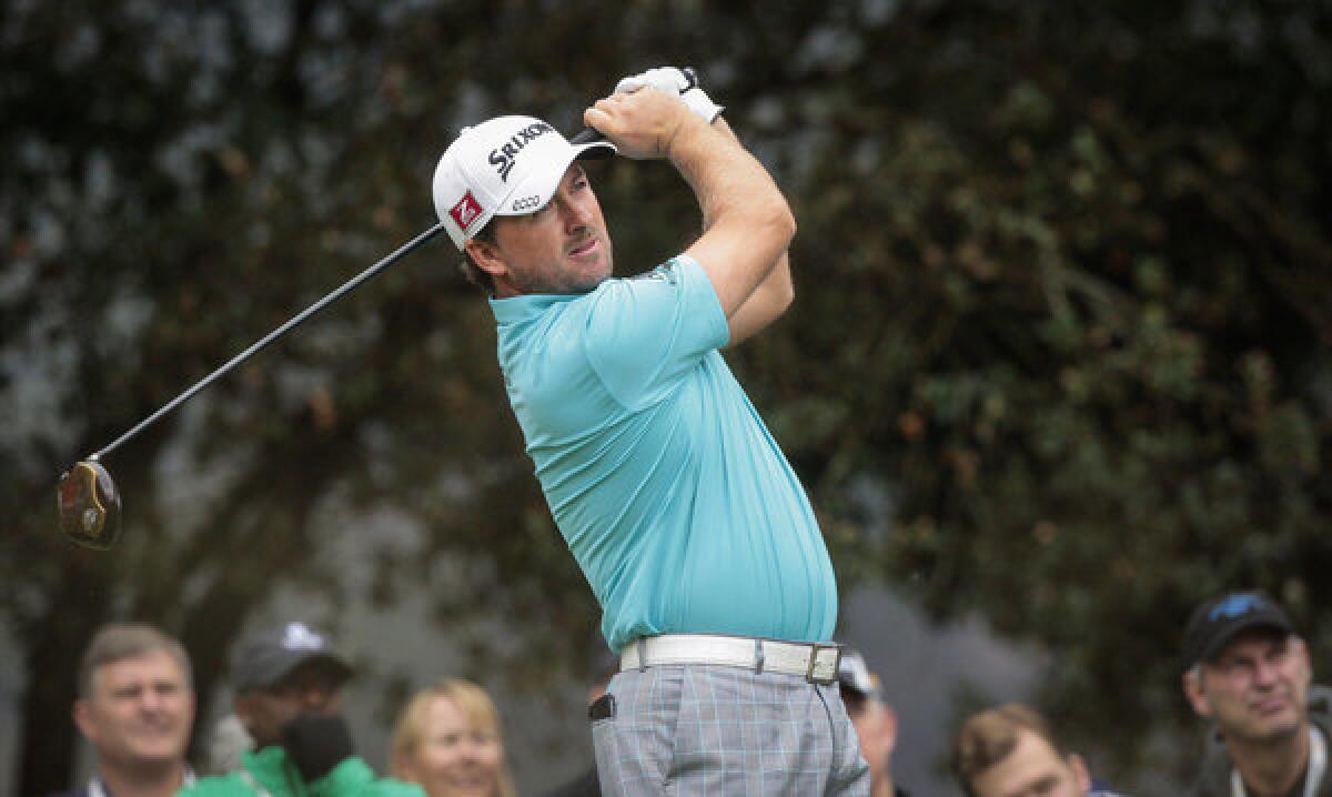 Graeme McDowell watches his tee shot at No. 2 on Friday during the second round of the World Challenge at Sherwood Country Club in Thousand Oaks.