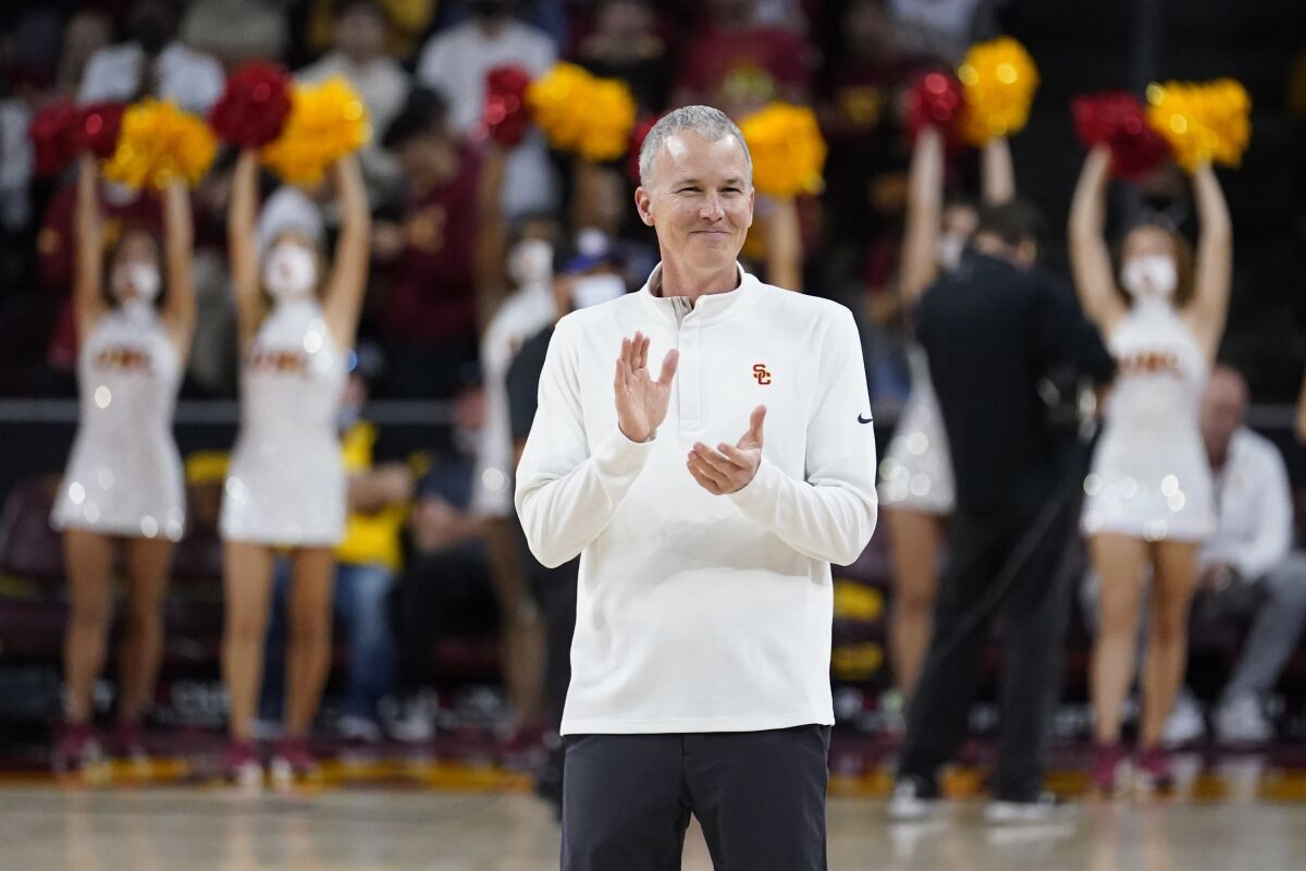 USC coach Andy Enfield claps during a game against Washington State on Feb. 20.