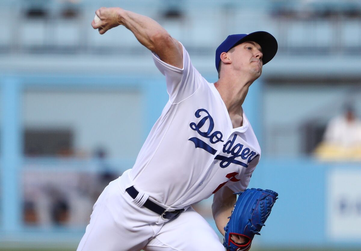 Dodgers starter Walker Buehler delivers during the first inning against the Colorado Rockies on Monday.