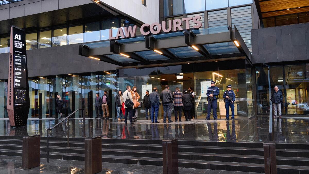 Members of the public wait in front of Christchurch High Court on April 5, 2019, in Christchurch, New Zealand.