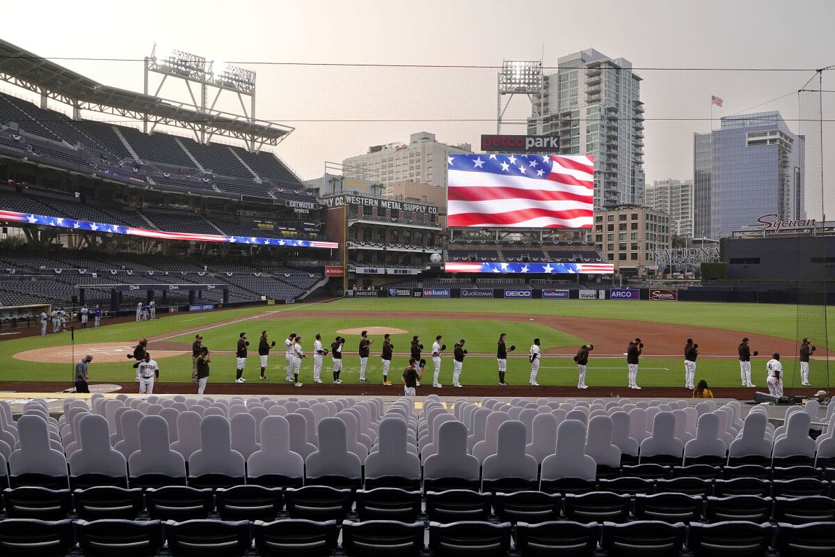 The San Diego Padres stand for the national anthem before Monday's game at Petco Park. 