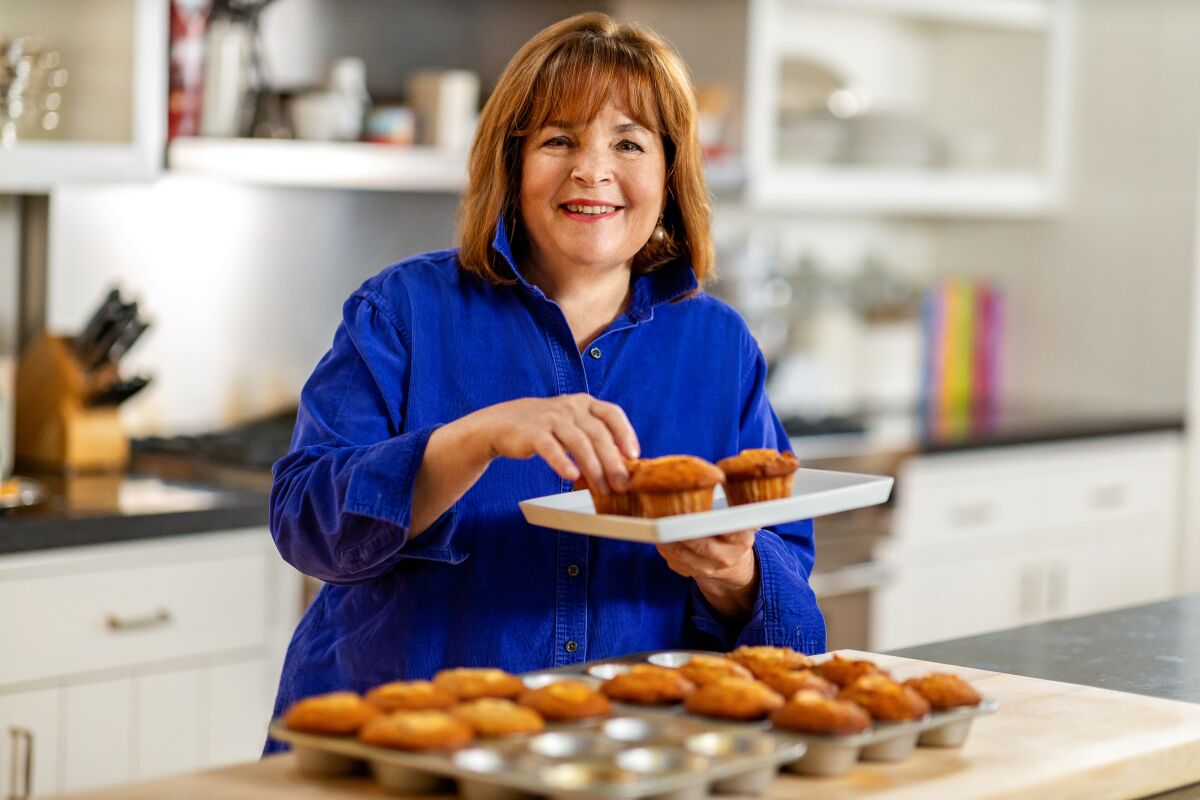 Ina Garten holds a pan of muffins in an episode of "Be My Guest"