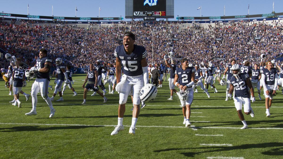 BYU wide receiver Aleva Hifo celebrates the Cougars' overtime victory against USC on Saturday.