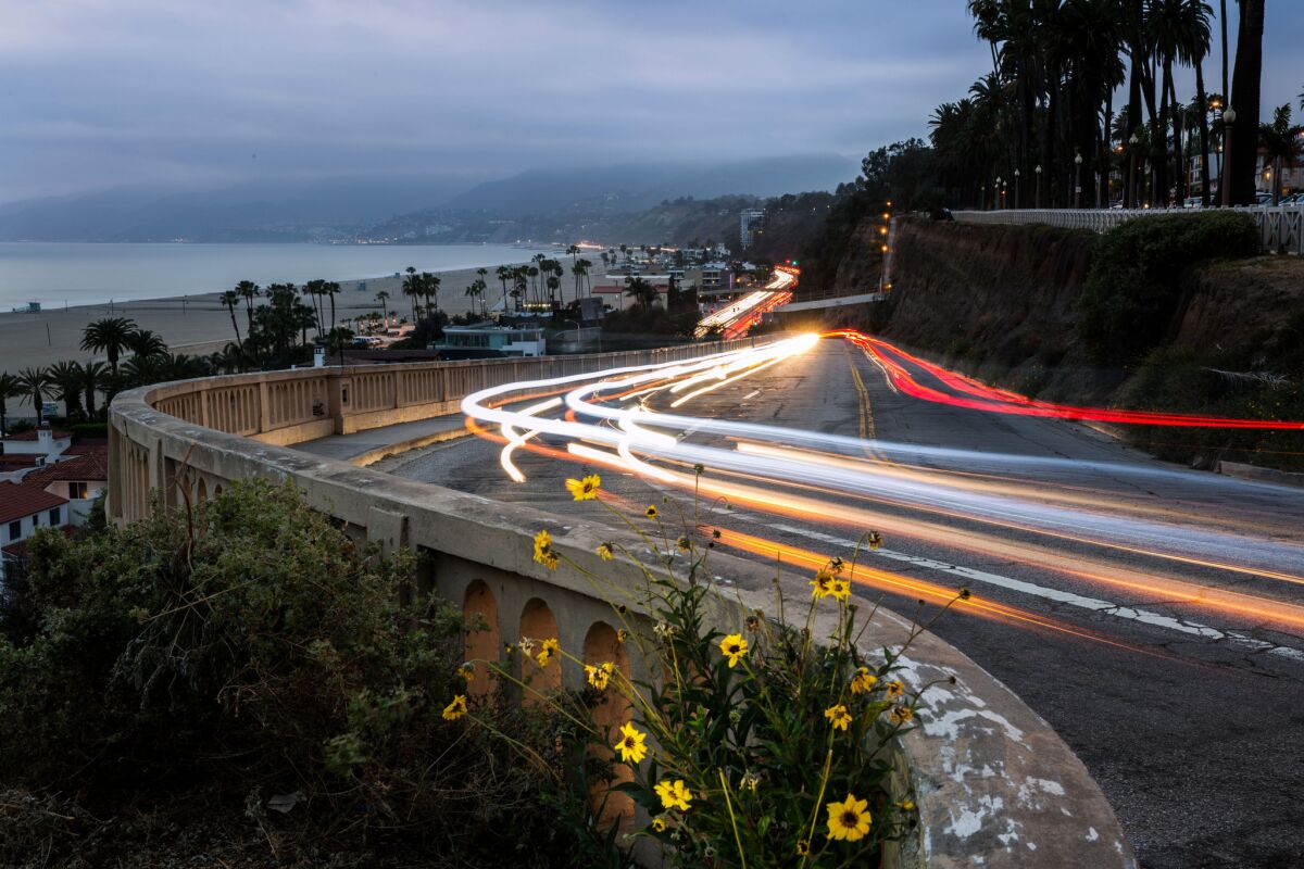 In March, the light trails of vehicles are shown moving up and down the California Incline in Santa Monica. Reconstruction of the deteriorating roadway is to start Monday.