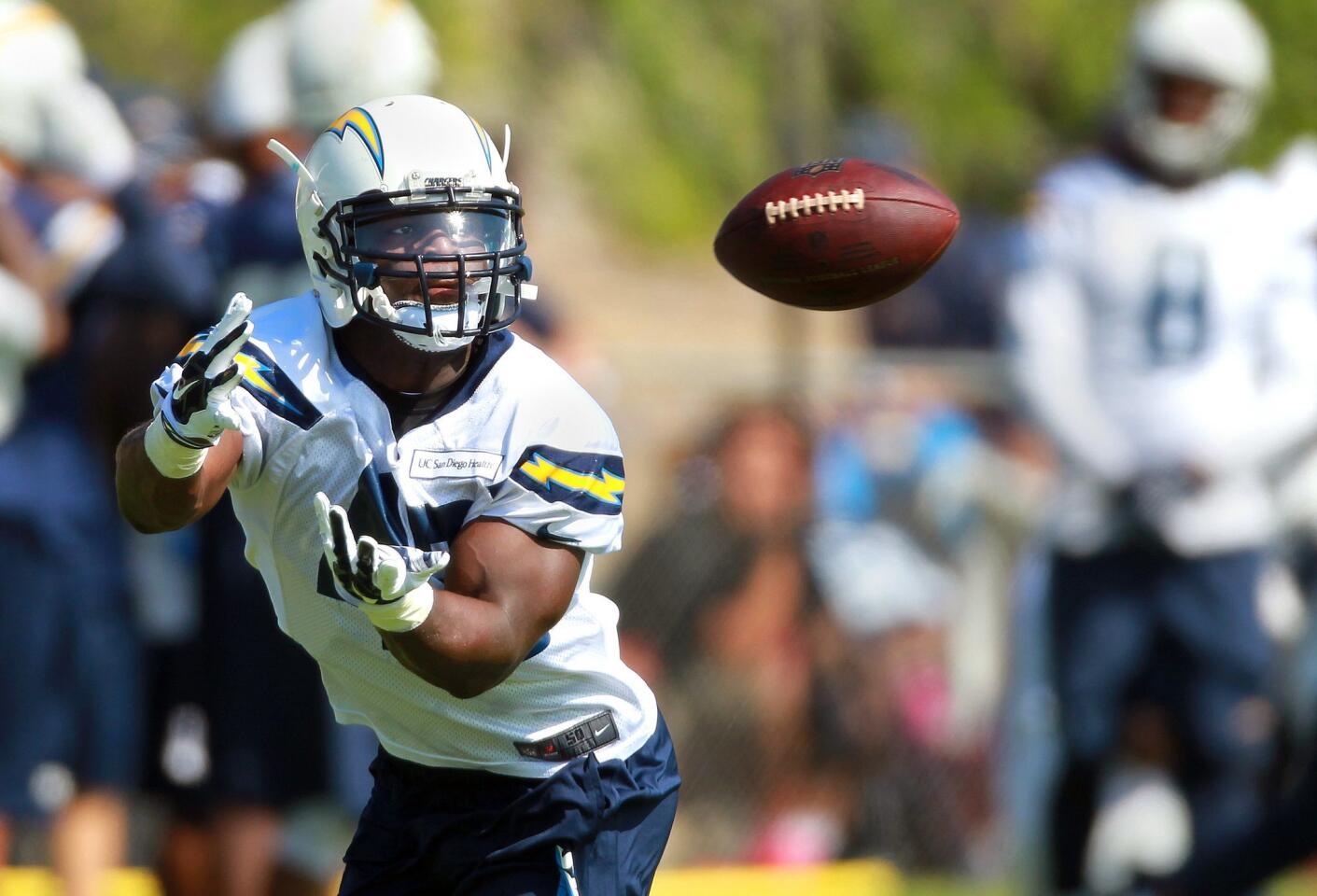 Chargers running back Branden Oliver catches on the field at Chargers Park on the first day of camp.