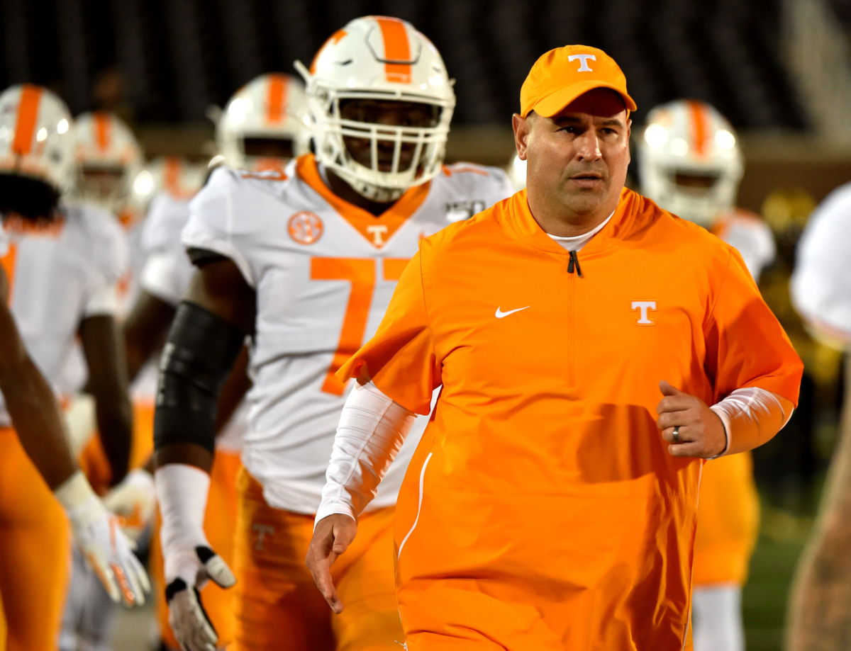 Tennessee coach Jeremy Pruitt of the Tennessee Volunteer runs onto the field with his players