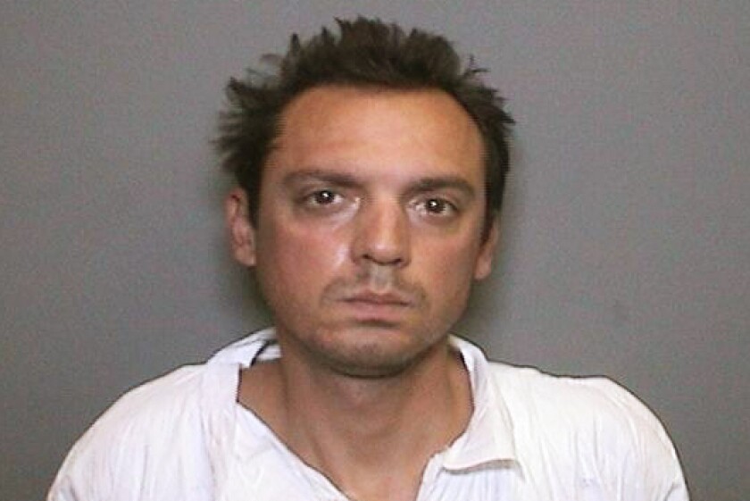 This undated booking photo provided by the Orange County District Attorney's Office shows Dennis Thomas Monson Jr. Monson, the suspect in the stabbing death of a man on a Southern California bike trail three years ago, has been found mentally unfit to stand trial. A judge ordered that Monson be committed to a state hospital for mental health treatment. The judge's ruling essentially places Monson's murder case on hold until it is determined he is able to understand the charges he is facing and assist with his own defense. (Orange County District Attorney's Office via AP)