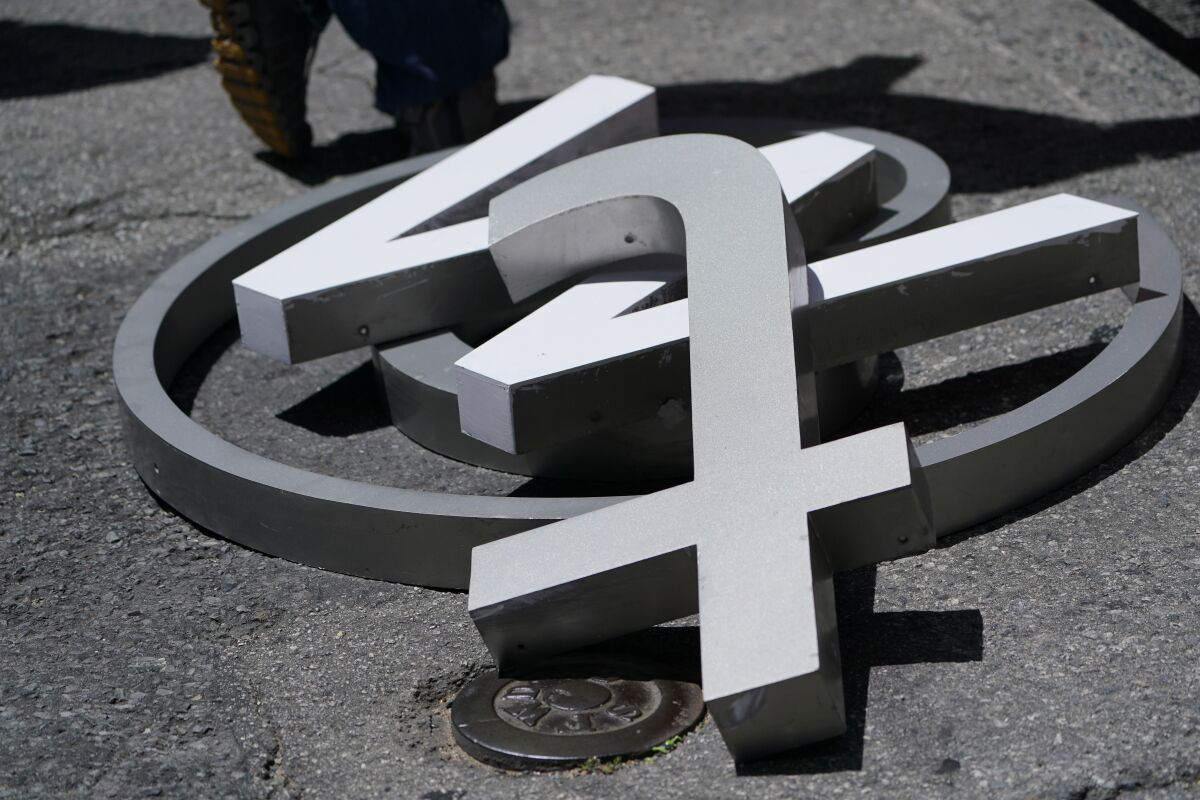 A pile of characters removed from a sign on the Twitter headquarters building are seen in San Francisco, Monday, July 24, 2023. Elon Musk has unveiled a new