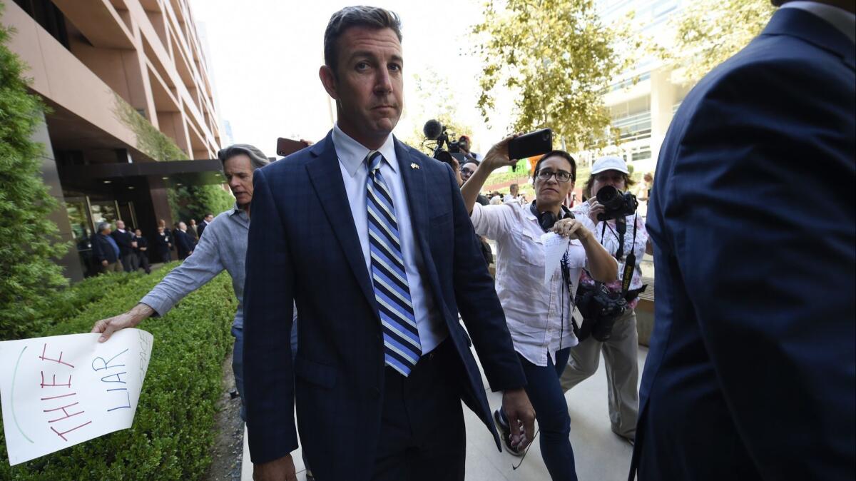 Rep. Duncan Hunter leaves an arraignment hearing in San Diego on Aug. 23.