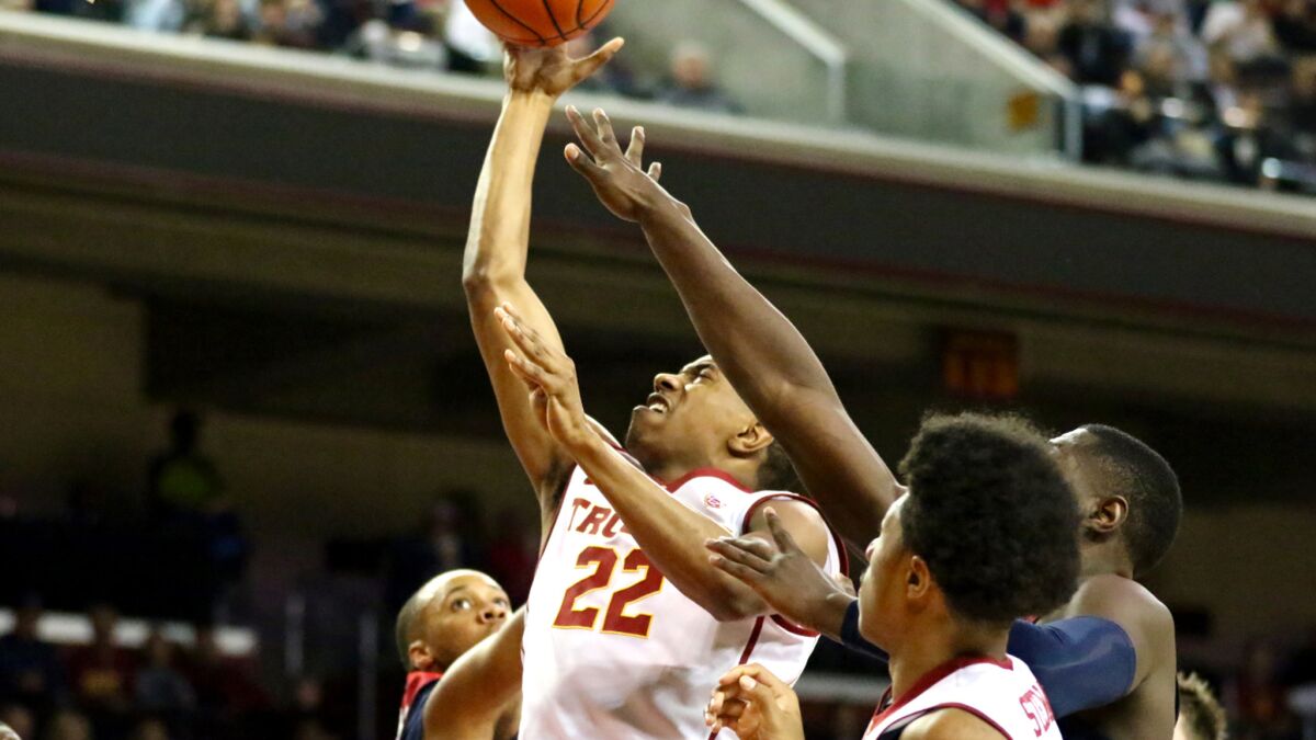 USC guard De'Anthony Melton drives to basket against Arizona during the first half.