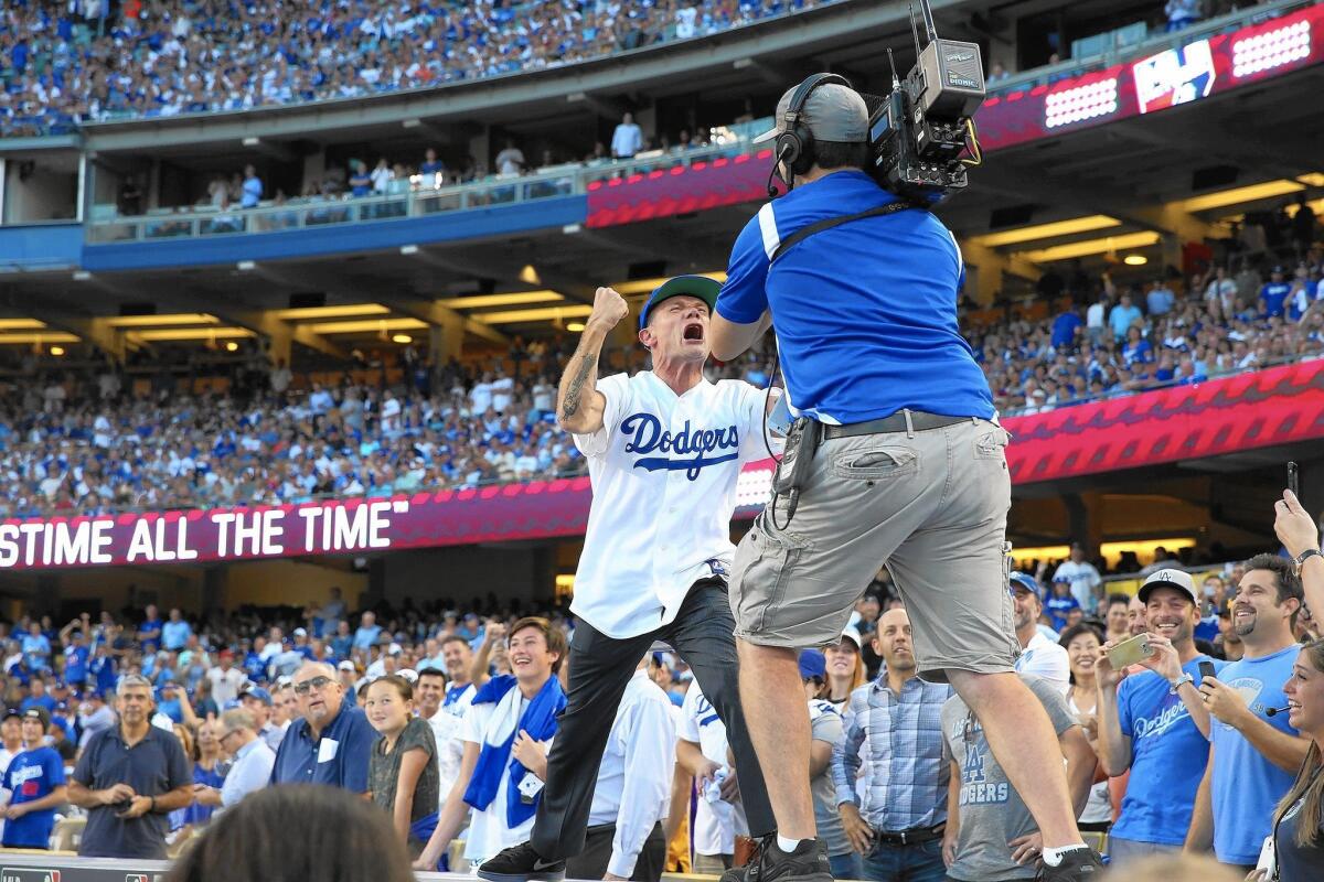 Flea pleads with Dodger fans during Game 5 of the 2015 National League Division Series at Dodger Stadium.