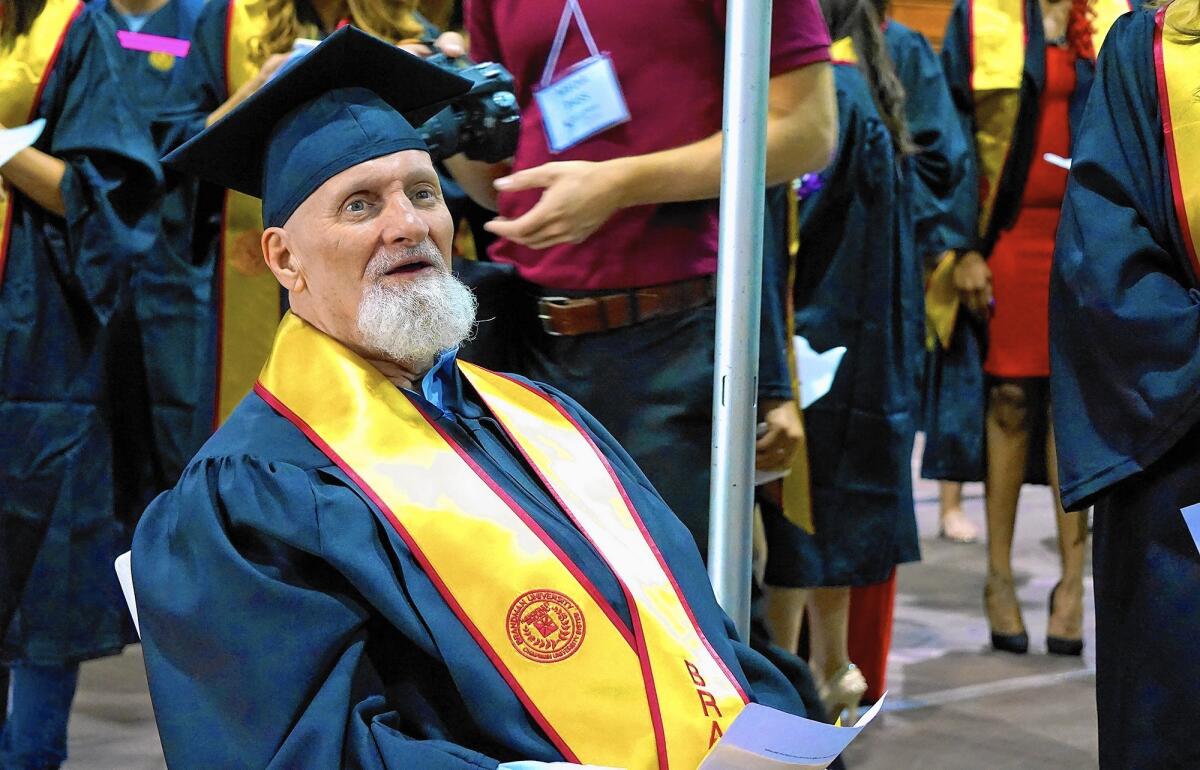 Joe Blackburn, 64, prepares to walk onto the stage at Brandman University's 2016 commencement ceremony. After spending almost 21 years in prison, he decided to go back to school and earn his bachelor's degree in sociology.