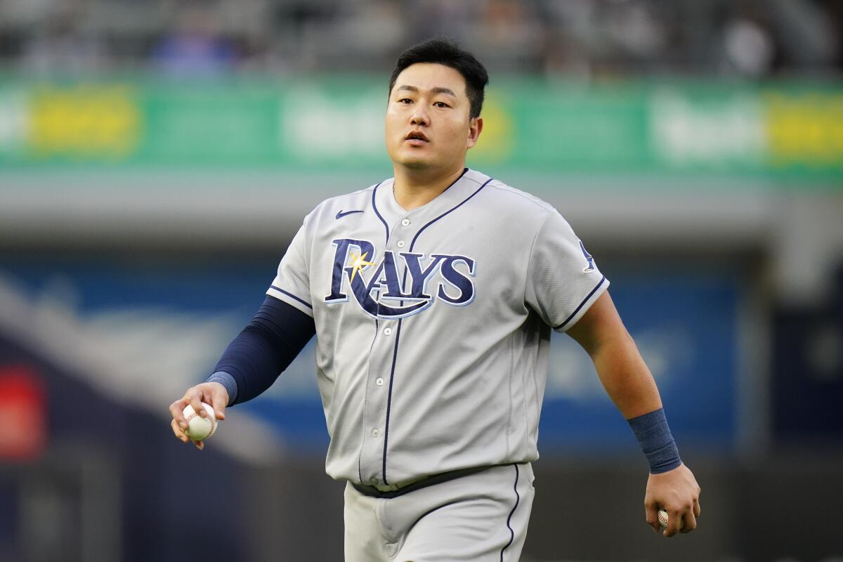 FILE - Tampa Bay Rays' Ji-Man Choi, of South Korea, warms up before a baseball game against the New York Yankees on Aug. 17, 2022, in New York. The Pittsburgh Pirates acquired Choi from Tampa Bay on Thursday, Nov. 10, 2022, in exchange for minor league pitcher Sam Hartman. (AP Photo/Frank Franklin II, File)