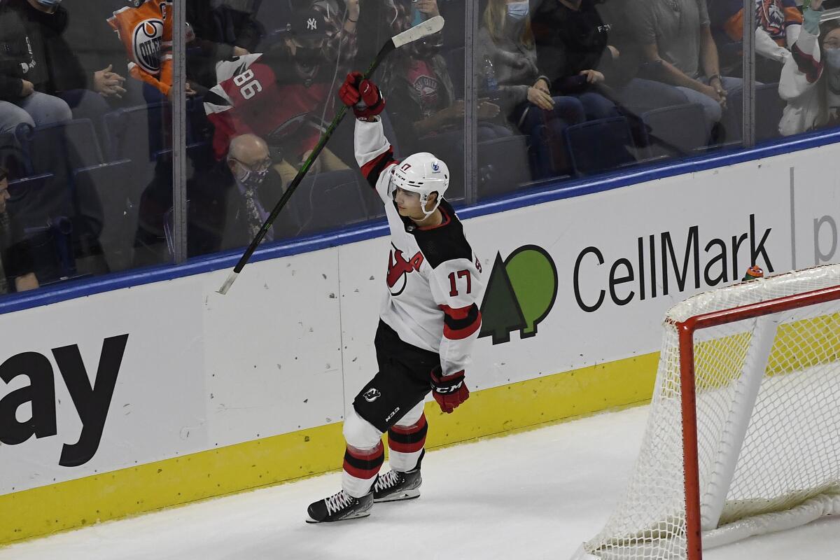 New Jersey Devils' Yegor Sharangovich celebrates after scoring the winning goal in overtime of a preseason NHL hockey game against the New York Islanders, Saturday, Oct. 2, 2021, in Bridgeport, Conn. (AP Photo/Jessica Hill)