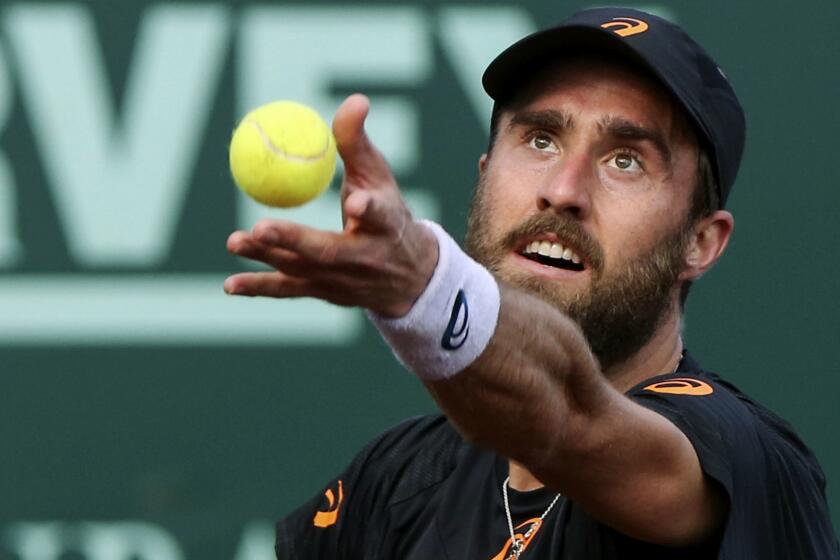 Steve Johnson, of the United States, serves to Jack Sock, of the United States, during the semifinals of the U.S. Men's Clay Court Championship tennis tournament at River Oaks Country Club on Saturday, April 15, 2017, in Houston. (Yi-Chin Lee / Houston Chronicle via AP)