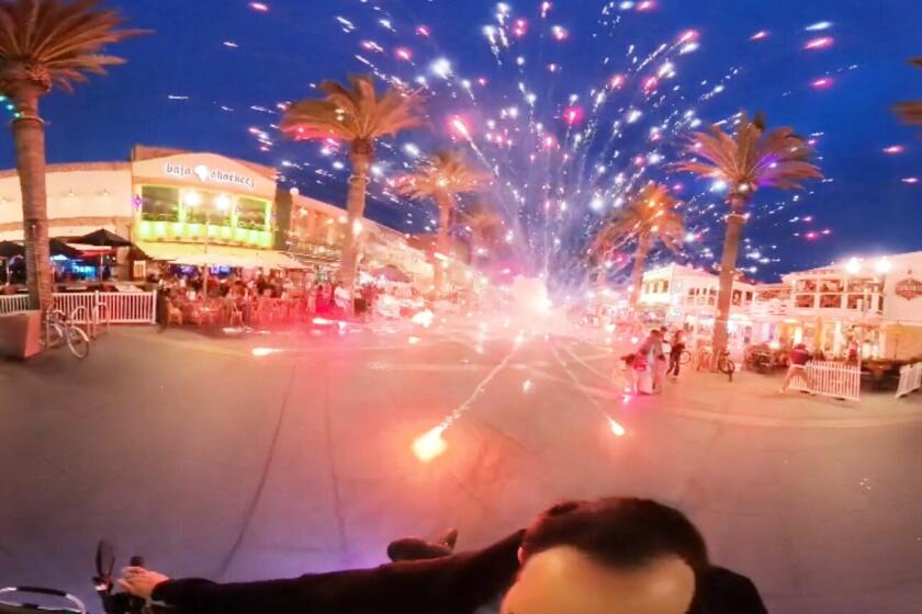 A group of teenagers set off fireworks on the pedestrian pathways on the Hermosa Beach Pier on Saturday, June 7, 2024. John Fahmy captured a firework exploding several yards away from him.