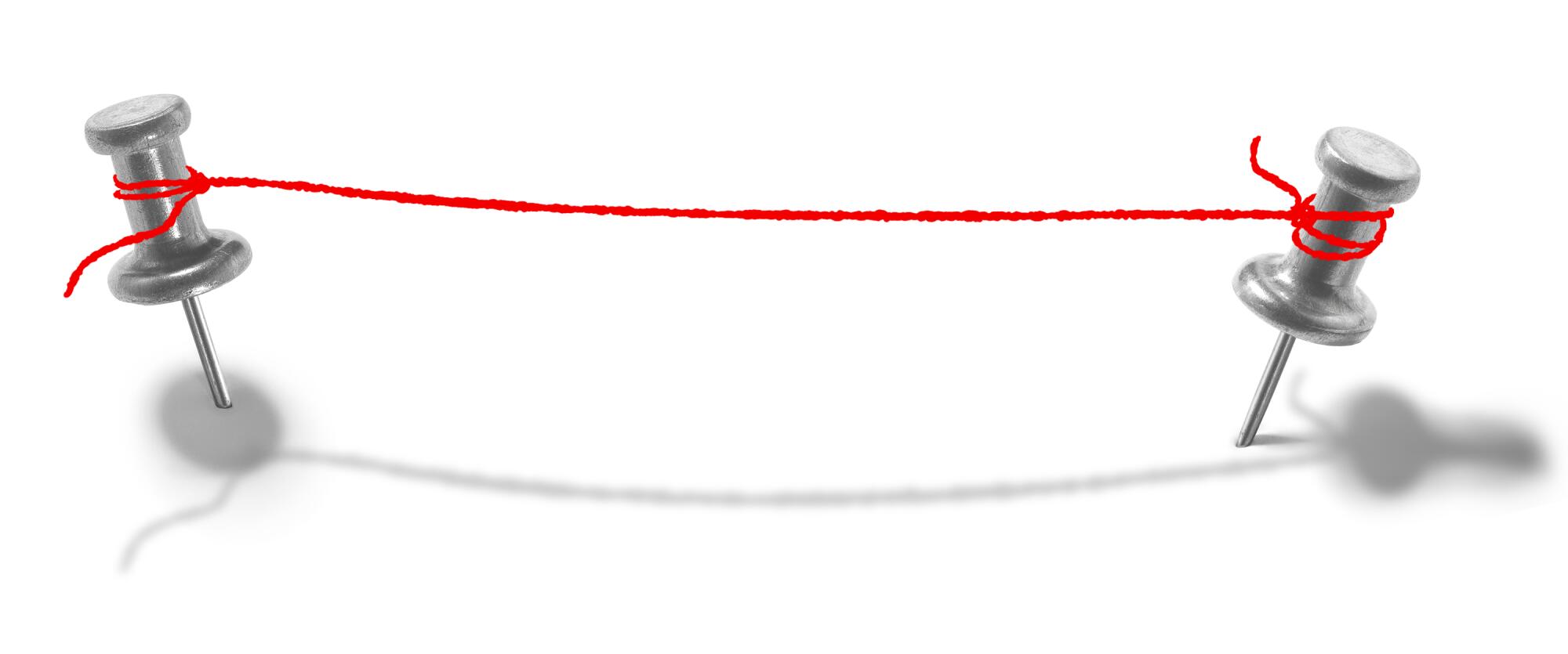 An illustration of a red string connecting two silver pushpins