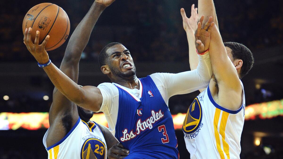 Clippers point guard Chris Paul drives to the basket during a playoff game against the Golden State Warriors last season. Paul is pleased with the NBA's new television contract.