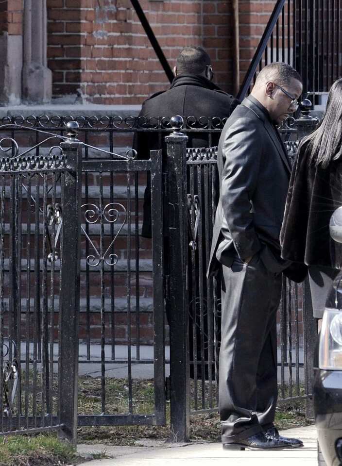 Bobby Brown waits for his car after leaving the funeral of his ex-wife, Whitney Houston.