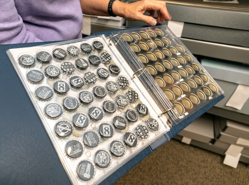 Curator Judith Downie shares a collection of bottle caps from Stone Brewing's eighth year of beer sales.  