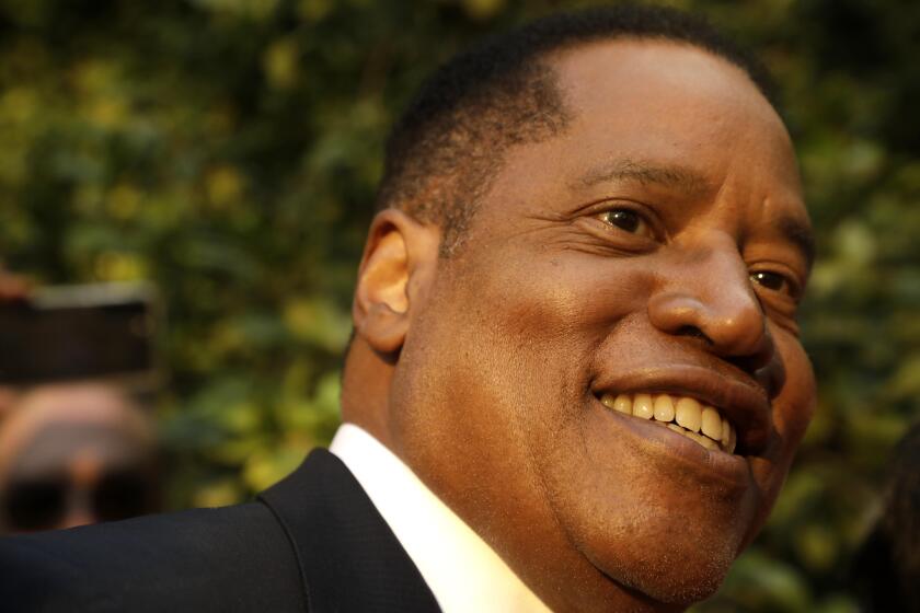 WOODLAND HILLS, CA - AUGUST 24, 2021 - Conservative radio talk show host Larry Elder, who is running for governor of California, greets supporters at the Warner Center Marriott in Woodland Hills on August 10, 2021. (Genaro Molina / Los Angeles Times)