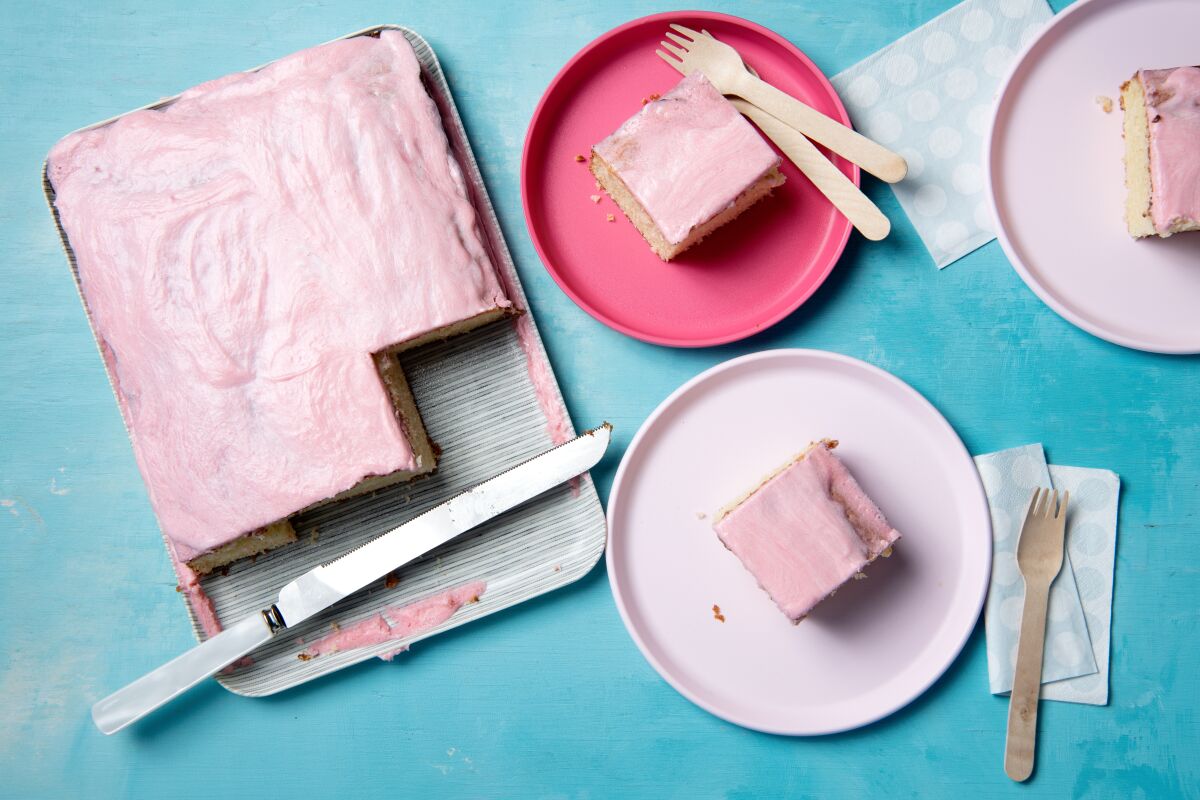 Pink-dyed frosting tops this classic vanilla cake