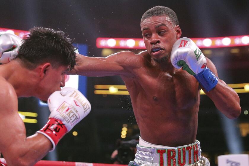 Mikey Garcia, left, fights Errol Spence Jr., right, in an IBF World Welterweight Championship boxing bout Saturday, March 16, 2019, in Arlington, Texas. (AP Photo/Richard W. Rodriguez)