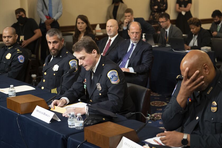 WASHINGTON, DC - JULY 27: Aquilino Gonell, sergeant of the U.S. Capitol Police, Michael Fanone, officer for the Metropolitan Police Department, and Harry Dunn, private first class of the U.S. Capitol Police, listen while Daniel Hodges, officer for the Metropolitan Police Department, testifies during a hearing of the House select committee investigating the January 6 attack on the U.S. Capitol on July 27, 2021 at the Cannon House Office Building in Washington, DC. Members of law enforcement testified about the attack by supporters of former President Donald Trump on the U.S. Capitol. According to authorities, about 140 police officers were injured when they were trampled, had objects thrown at them, and sprayed with chemical irritants during the insurrection.(Photo by Brendan Smialowski-Pool/Getty Images)