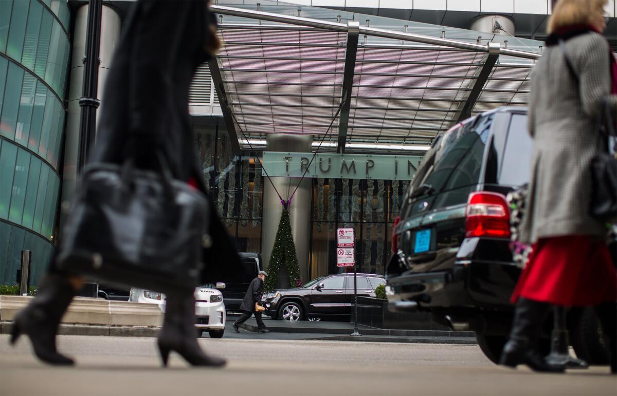 Pedestrians pass by the Trump International Hotel and Tower in Chicago on Tuesday.