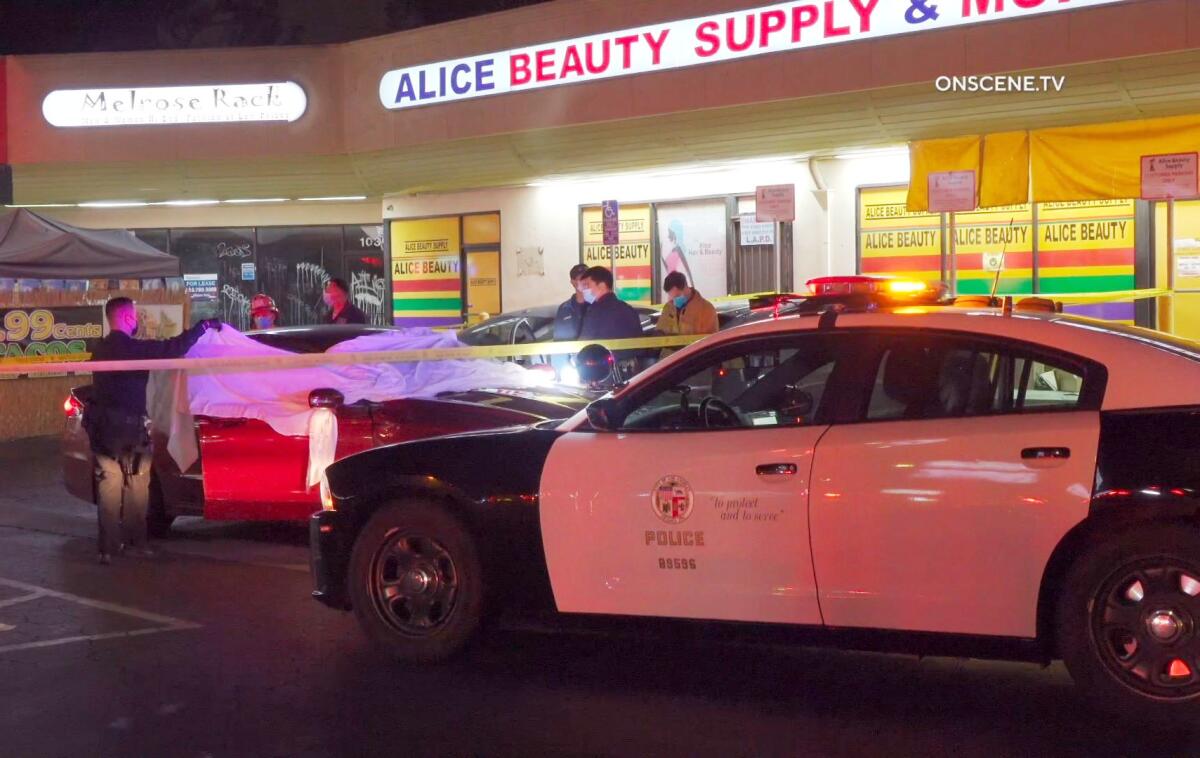 An LAPD patrol car sits outside a strip mall in Arlington Heights.