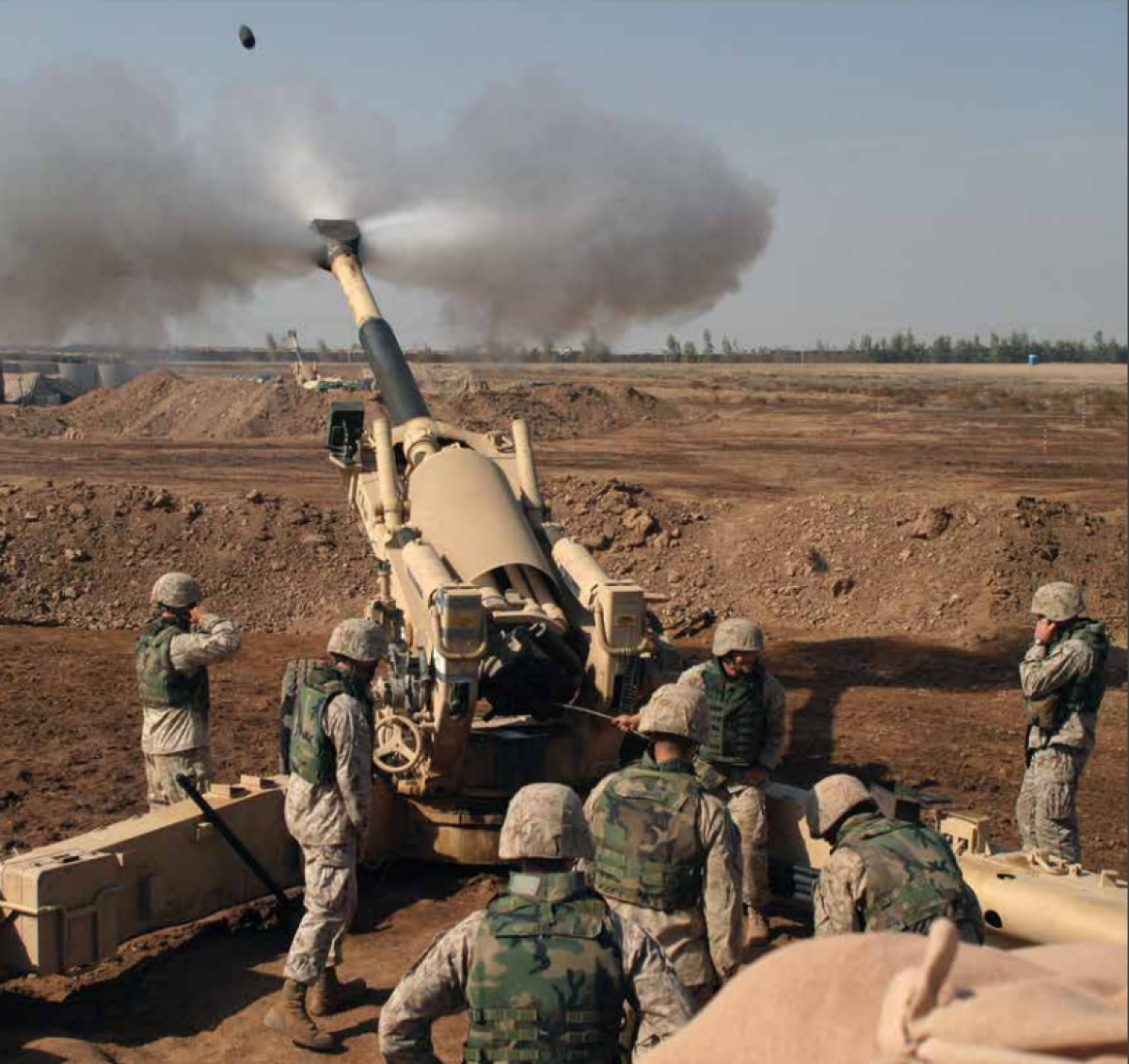 A Marine gun crew fires a 155mm howitzer during Operation al-Fajr outside Fallujah, Iraq in 2004.