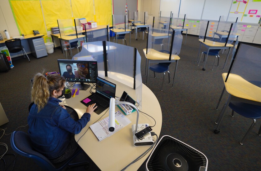At Vista Square Elementary in April Julieta Castruita taught her 5th grade students remotely in her empty classroom. 