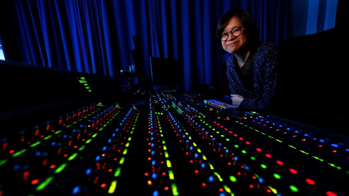 Ai-ling Lee, an Oscar-nominated sound editor and sound mixer for "La La Land," sits at the mix board inside the sound design room at Fox Studios in Los Angeles on.