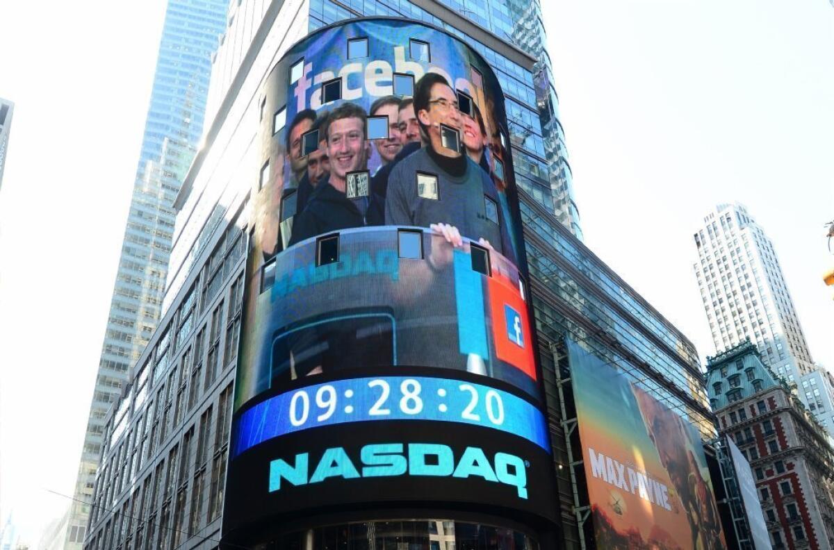 Facebook Chief Executive Mark Zuckerberg is seen on a screen in New York's Times Square getting ready to ring the NASDAQ stock exchange opening bell on May 18, 2012, the day Facebook stock first hit the market. On Wednesday, Facebook stock exceeded $45 a share for the first time.