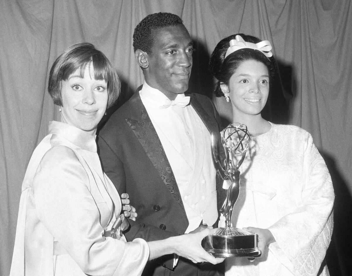 Carol Burnett, left, and Bill Cosby with Cosby's wife, Camille, at the Emmy Awards in 1966, where Cosby won his first Emmy for his role in 'I Spy.'