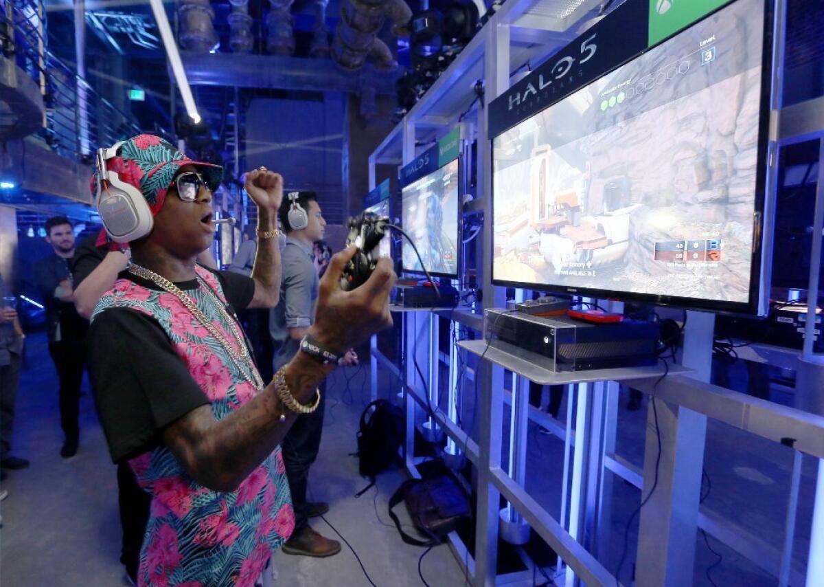Rapper Soulja Boy plays "Halo 5" during the Xbox One E3 Showcase Party at The Majestic Downtown on Monday.