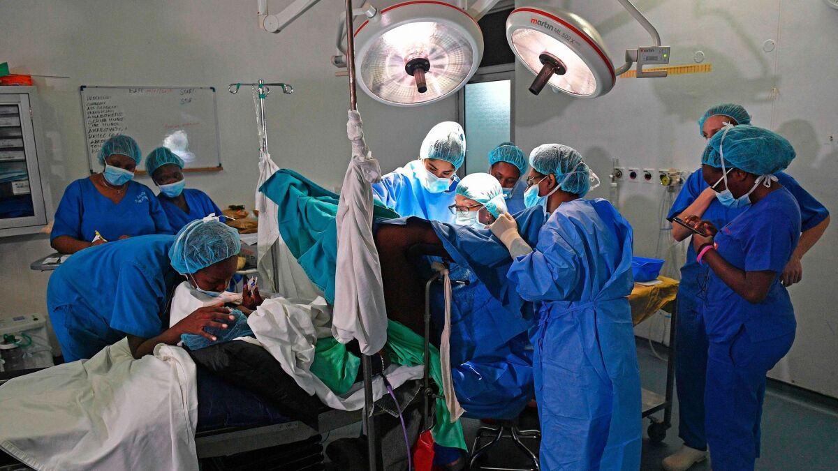 Californian gynecological surgeon Dr. Marci Bowers performs surgery in Nairobi, Kenya, to restore the body of a woman who was a victim of female genital mutilation.