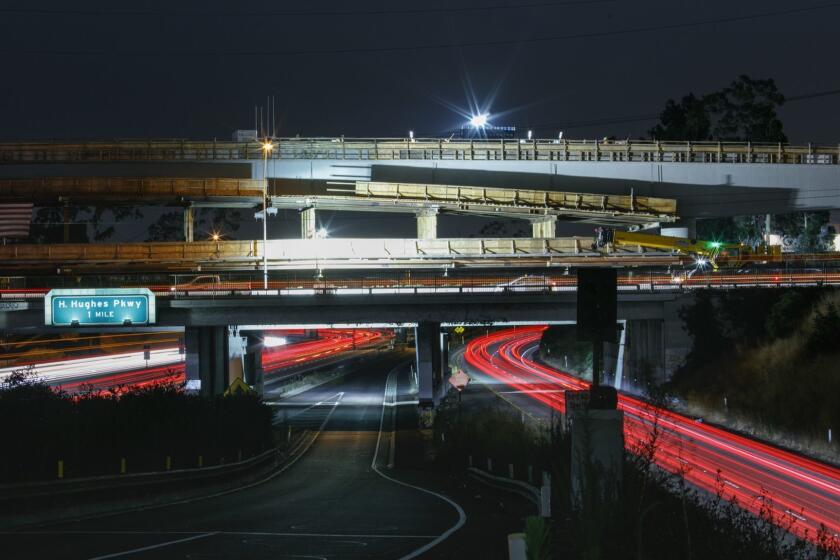 INGLEWOOD,CA --MONDAY, JULY 31, 2017--Long exposures showing blurring cars in northbound traffic on the I-405, seen from the W. Manchester Boulevard onramp, while Los Angeles County Metropolitan Transportation Authority (Metro) construction work on the completion of a bridge for the Crenshaw/LAX line of the light rail project, along Florence Boulevard in Inglewood, CA, July 31, 2017. (Jay L. Clendenin / Los Angeles Times)