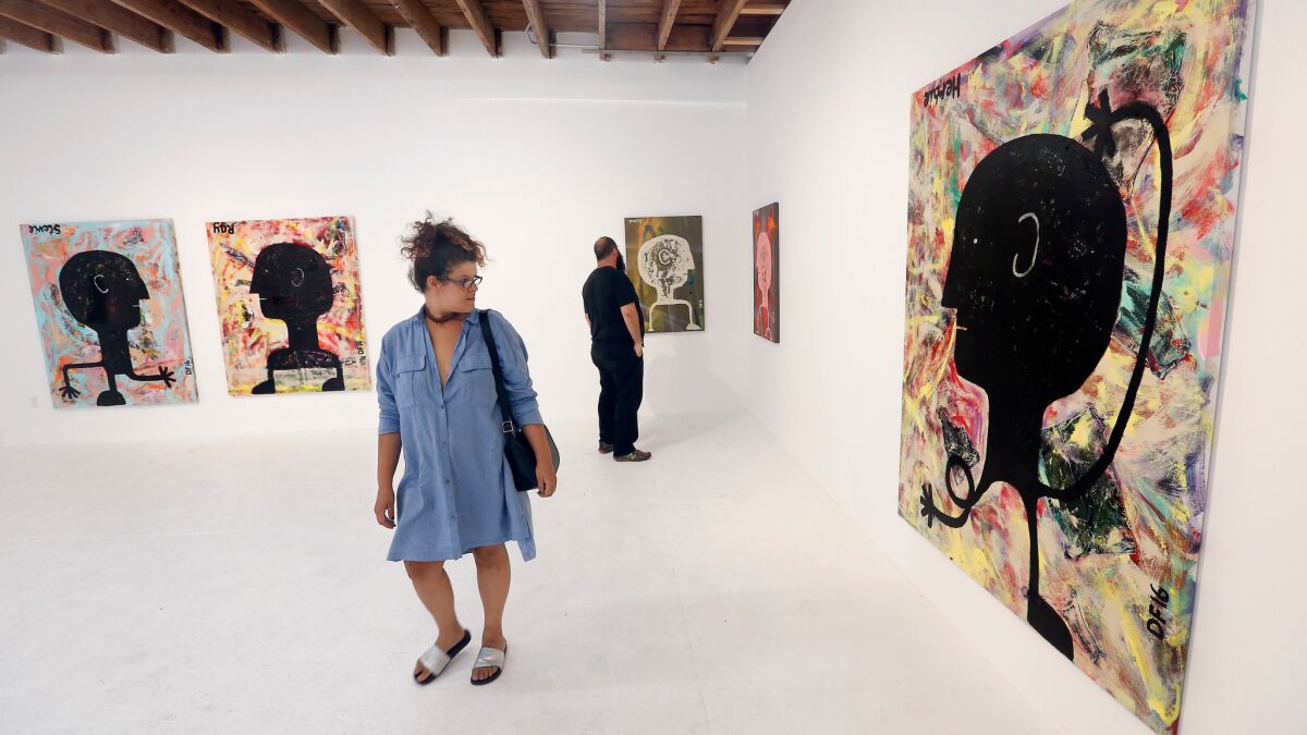 Gallery goers attend an exhibition at Chimento Contemporary in August.