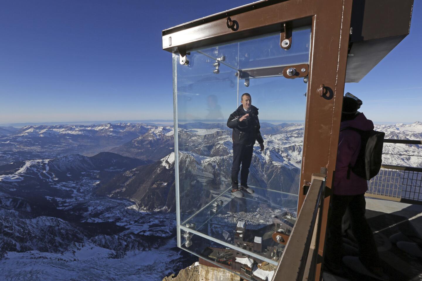 This one's not for people with a fear of heights: A French tourism company has suspended a glass cube with a see-through bottom from a peak in the Alps, offering a breathtaking view some 3,000 feet down. Mathieu Dechavanne, head of the Compagnie du Mont Blanc which runs the new attraction, stands in a glass cage named "Pas dans le Vide" or "Step into the Void" at the top of the Aiguille du Midi peak in the French Alps during a press visit.