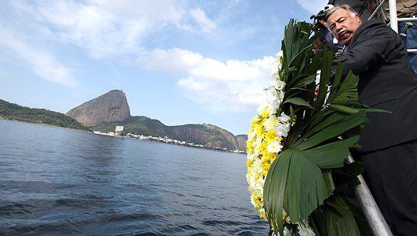 The leader of France's Senate, Gerard Larcher, throws a wreath into Guanabara Bay in Rio de Janeiro to honor the 228 people killed May 31 when an Air France jet plunged into the Atlantic. "In the navy tradition, I am going to throw flowers into the sea in homage of those lost," he told reporters before heading out into the bay. He said he was visiting Brazil to show his gratitude to Brazilian authorities for the way they handled the disaster and the search for bodies and debris from the plane.