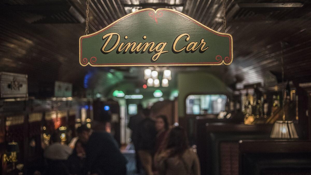 The main dining room of the Pacific Dining Car in downtown Los Angeles is made to look like a train dining car