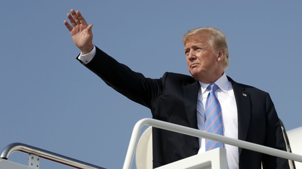 President Trump waves as he boards Air Force One at Andrews Air Force Base, Md., on July 3. Trump is scheduled to hold a rally in Great Falls, Mont.