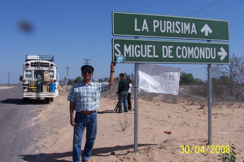 Enoc Fuentes López stands at the junction leading to La Purísima and the towns of San Miguel and San José de Comondú in Baja California Sur in 2008 during the filming of the documentary “El Viaje del Cometa” (“The Journey of the Comet”).