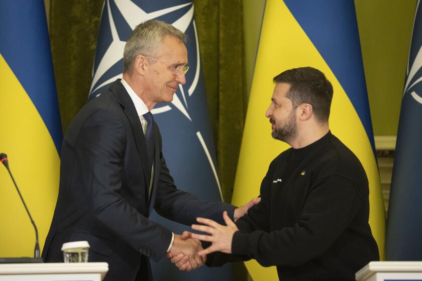 NATO Secretary General Jens Stoltenberg and Ukrainian President Volodymyr Zelenskyy, right, greet each other after joint press conference in Kyiv, Ukraine, Thursday, Apr. 20, 2023. (AP Photo/Efrem Lukatsky)