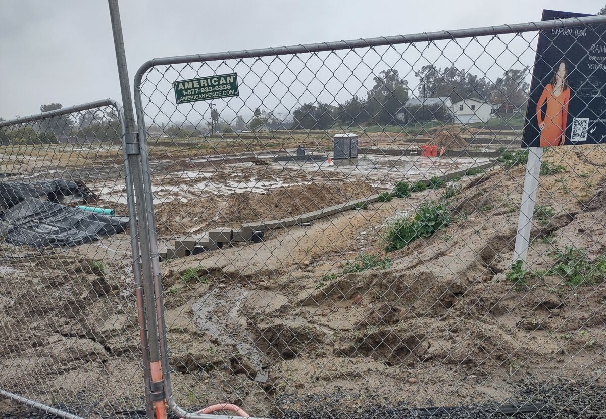 Rainwater is piling up at the Ramona Trails 10-home subdivision development site at the corner of Third and F streets.