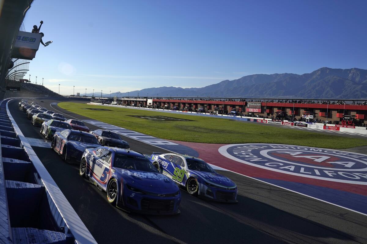Kyle Larson leads the field under caution during a race at Auto Club Speedway in 2022 in Fontana.