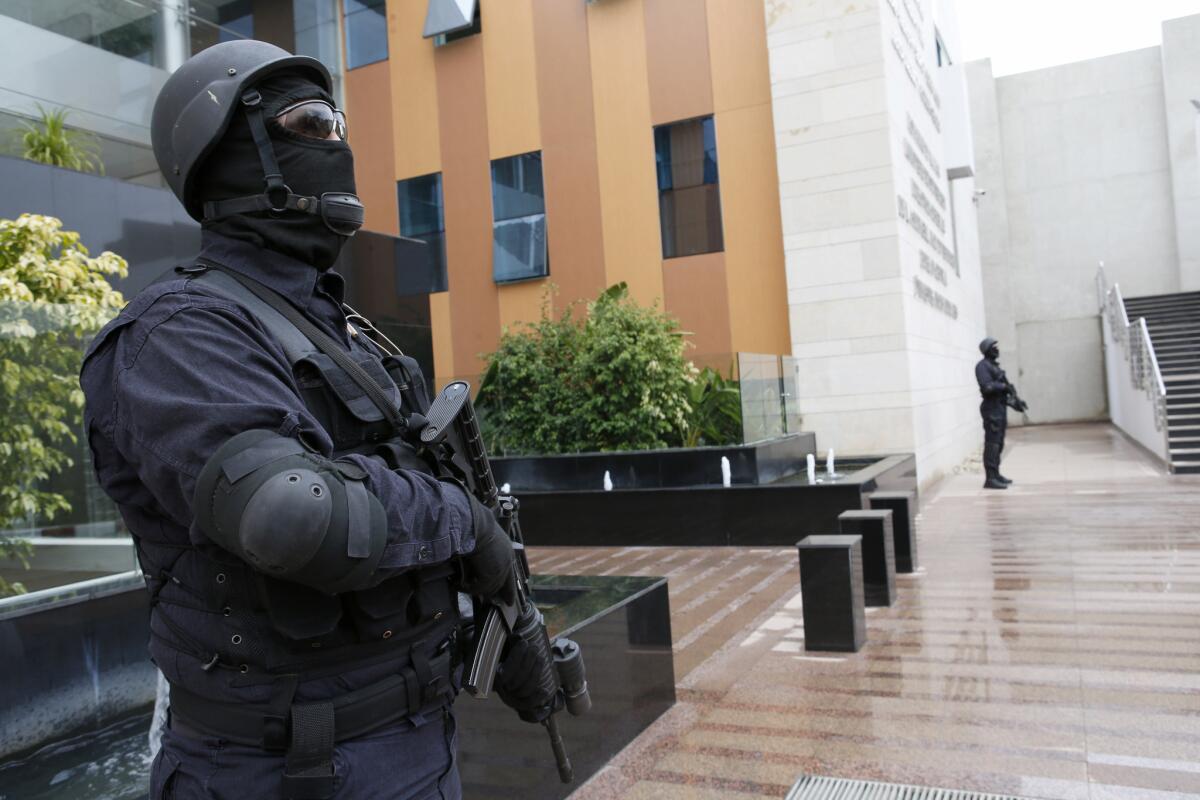 Moroccan anti-terrorism forces guard the Central Bureau of Judicial Investigations in Sale, Morocco. Moroccan authorities have announced the arrest of a Belgian they say is linked to the Paris attackers.